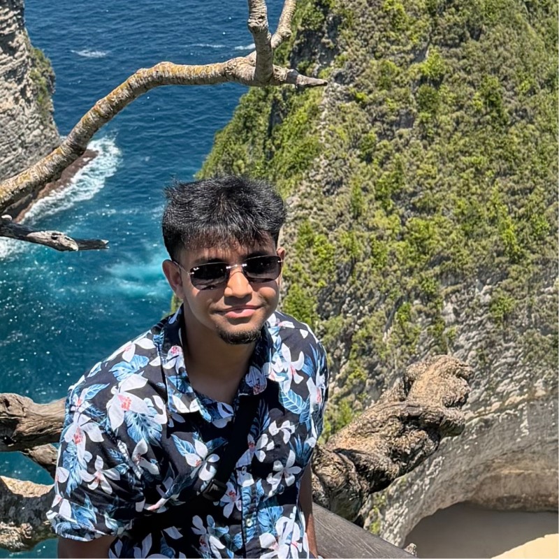 Safwan Haque on a clifftop above the ocean